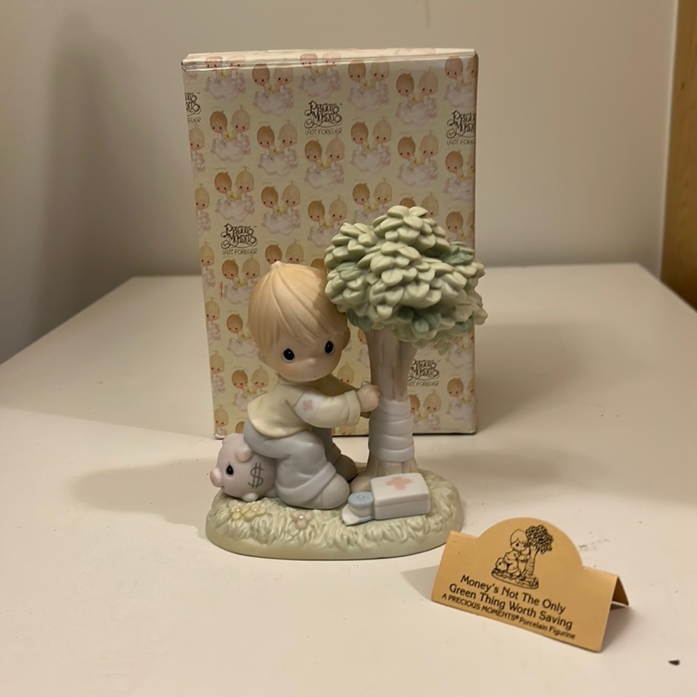 Precious moments figurine 1994 “Moneys Not the Only Thing Worth Saving”